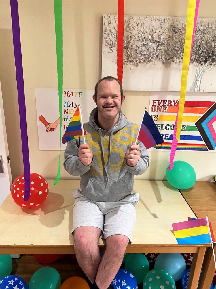 Person with rainbow flags