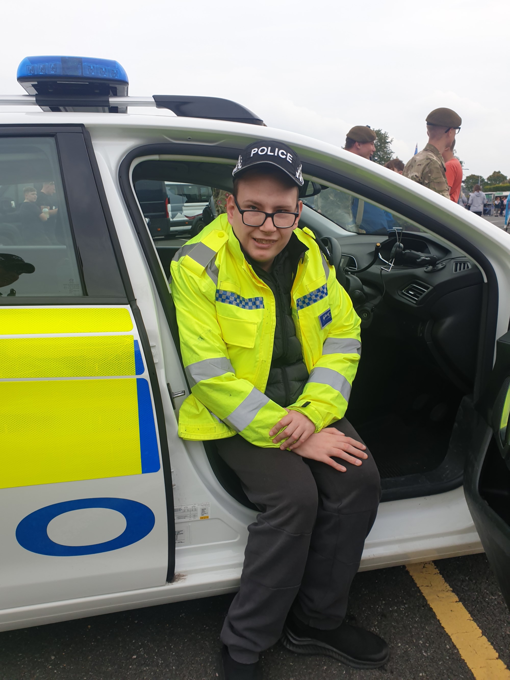 Person in police car