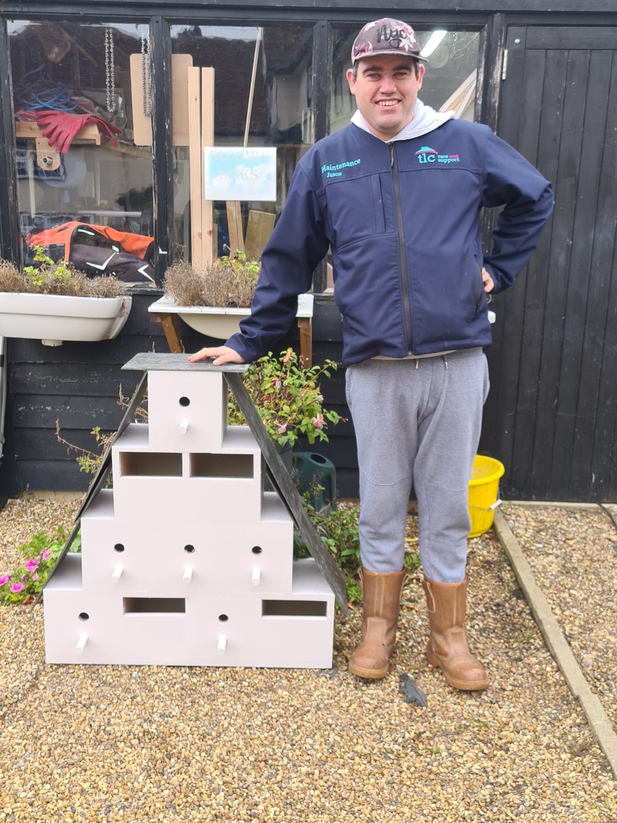 person with bird boxes