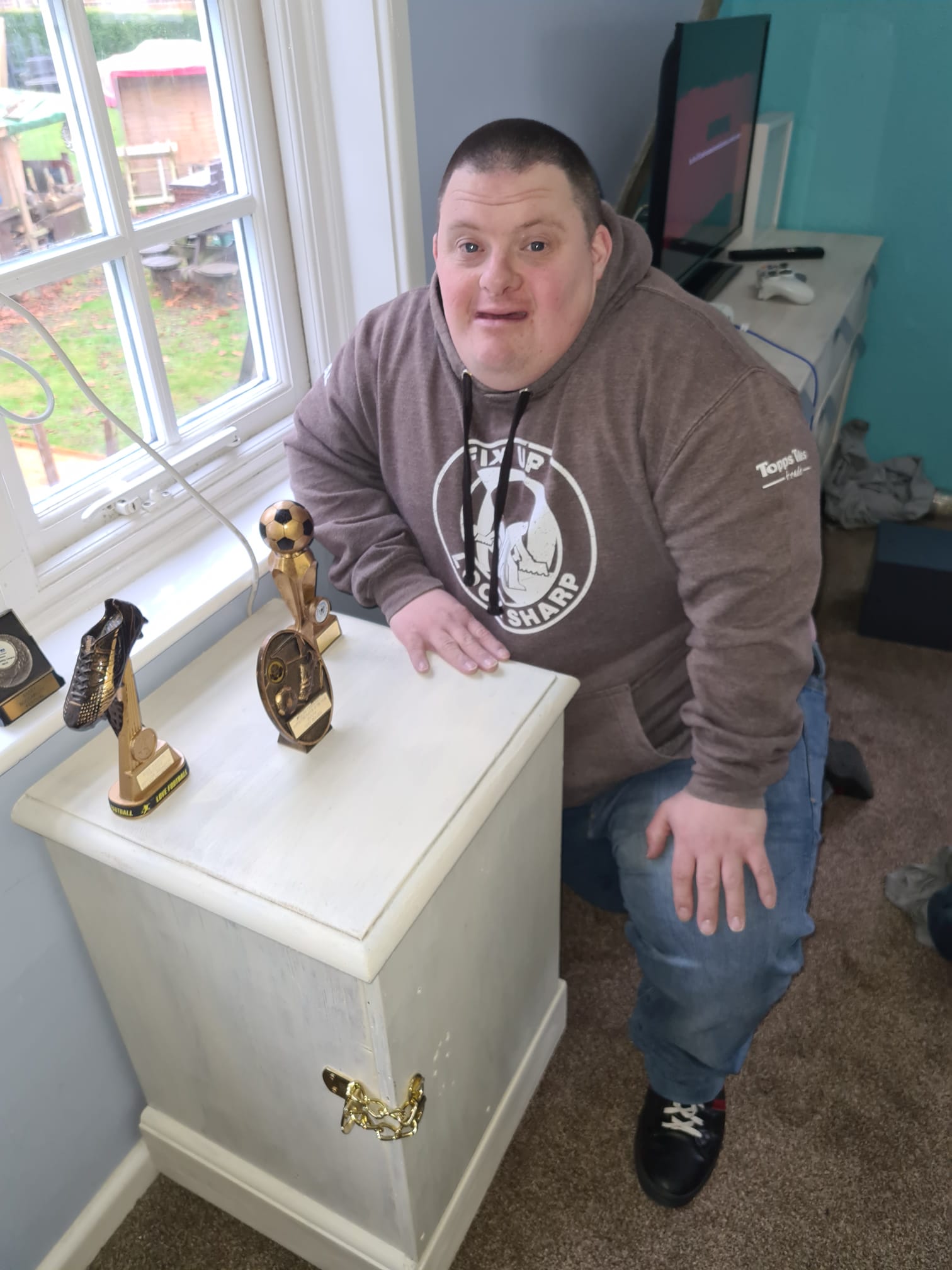 person with trophies