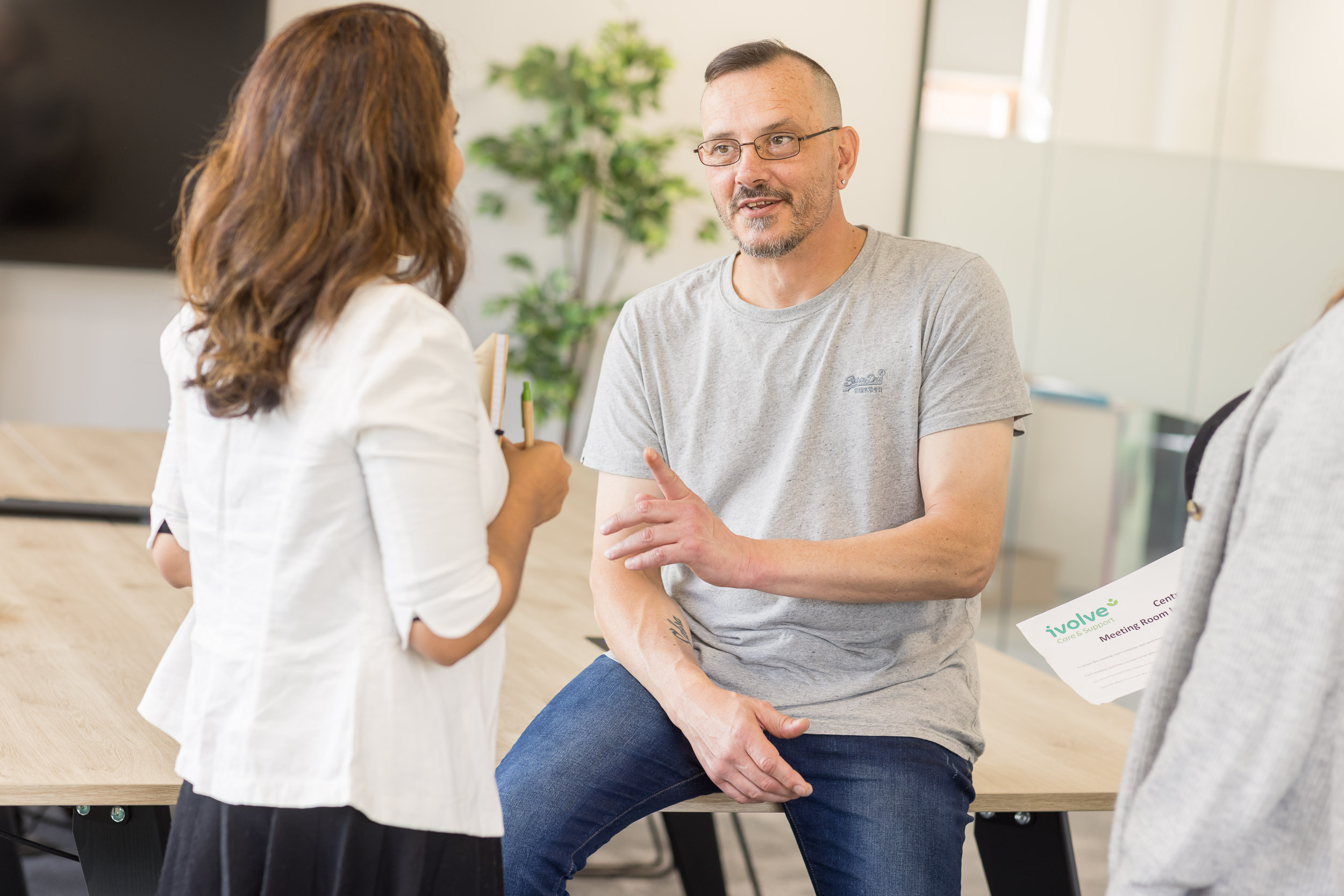 Two support workers talking